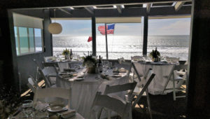 Wedding reception guest tables with ocean view